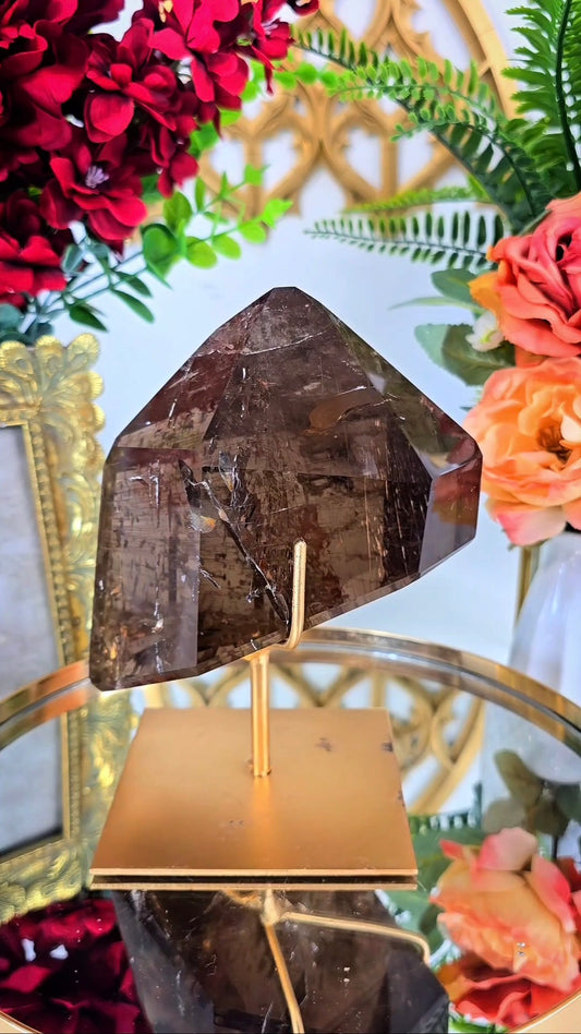 Huge Smoky Rutile Quartz on stand